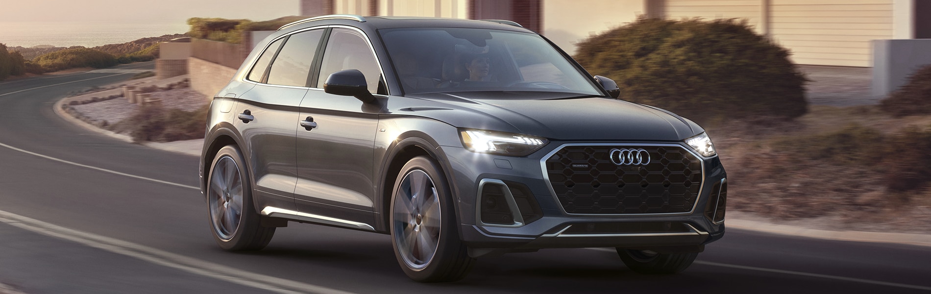 2024 Audi Q5 in silver running on street