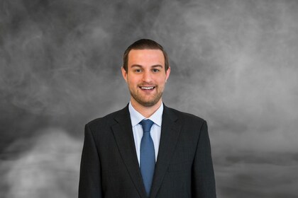 Staff member Tyler Guyot  from ID_0beedc4b0aa2