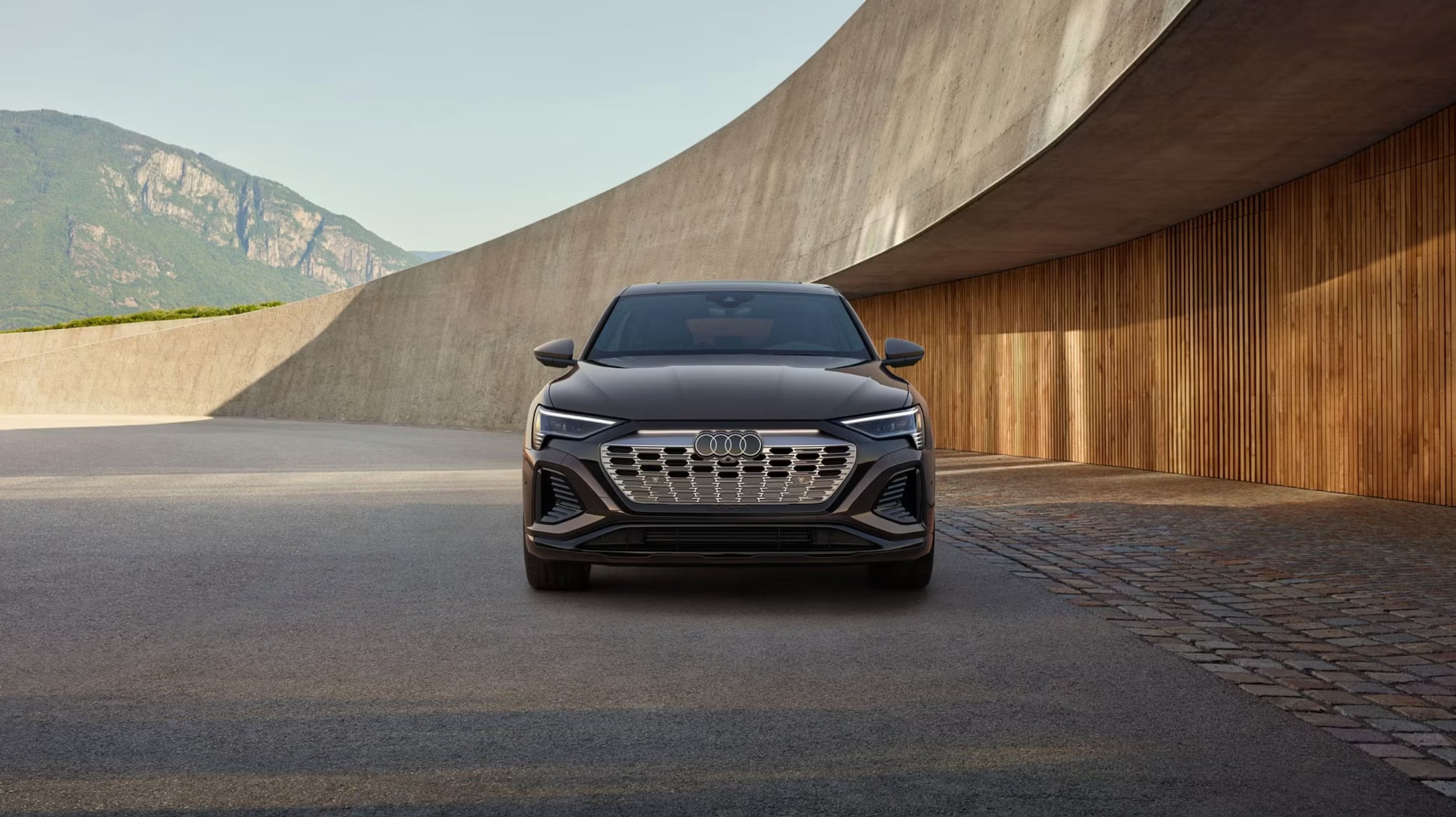 Front view of an Audi Q8 e-tron Sportback parked.