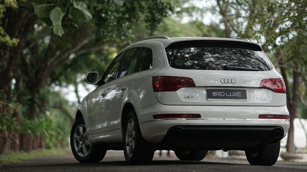 Parked%20Audi%20Q7%20on%20Asphalt%20Road.png
