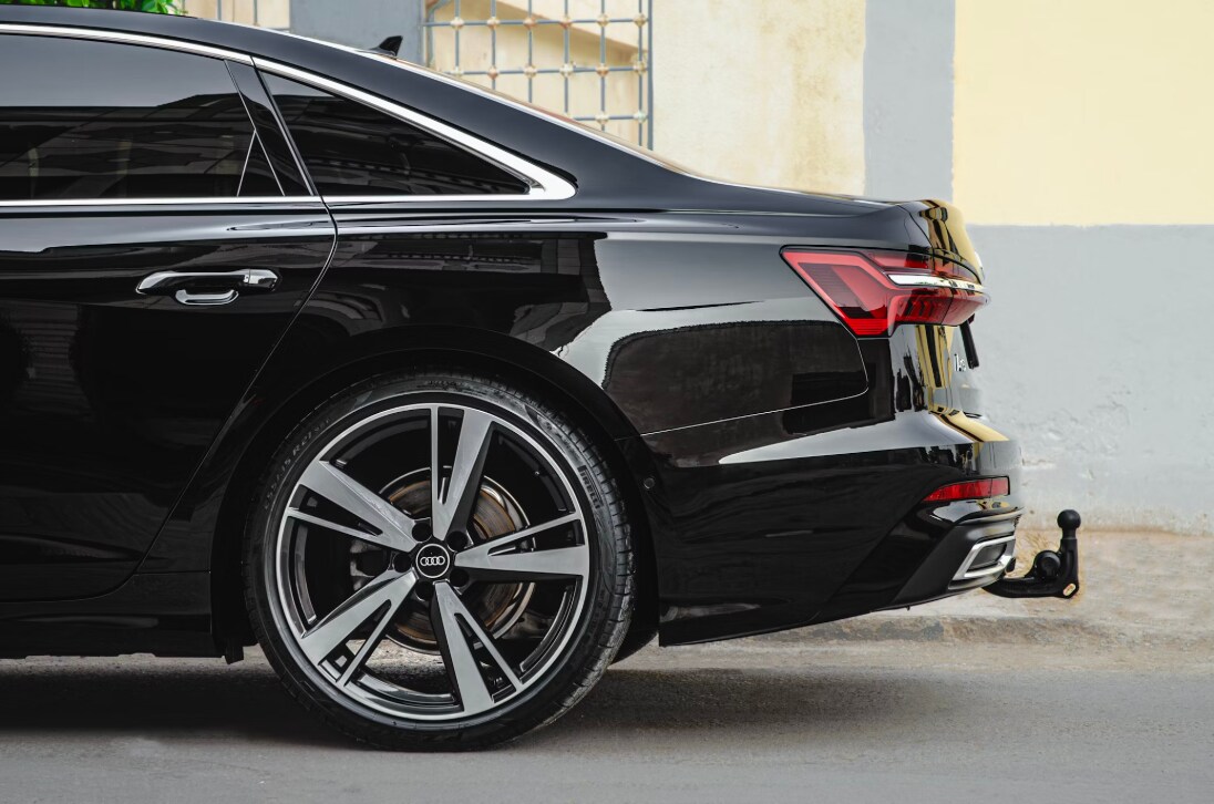 a%20black%20car%20parked%20in%20front%20of%20a%20building.png