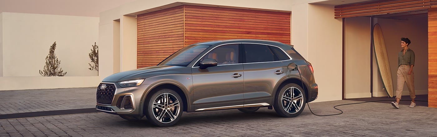 Audi Q5 e PHEV charging at a beach house