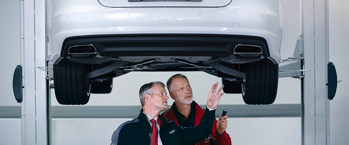 Audi Pensacola Mechanics Inspecting Brakes in Pensacola, FL