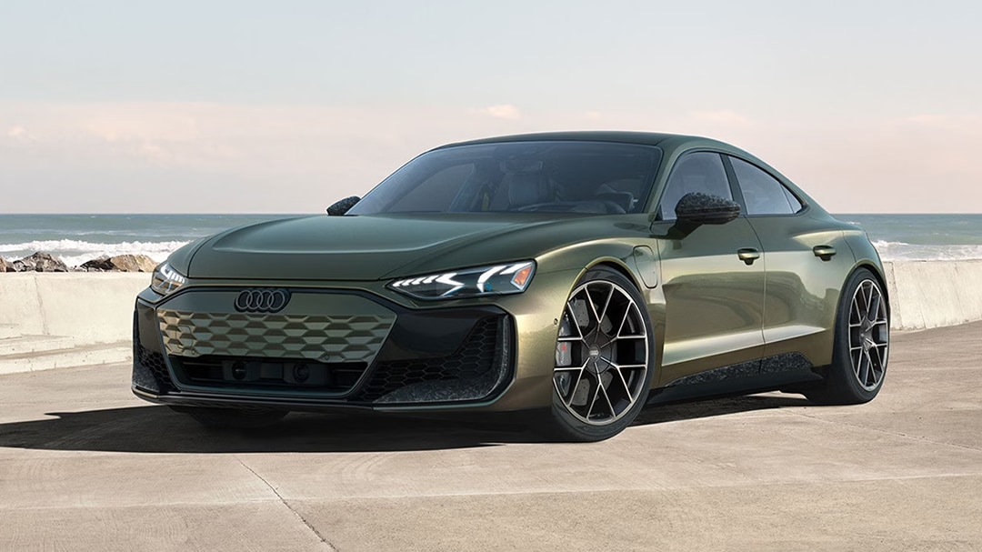3/4 front and side view of the Audi RS e-tron GT 2025 at a seaside stop