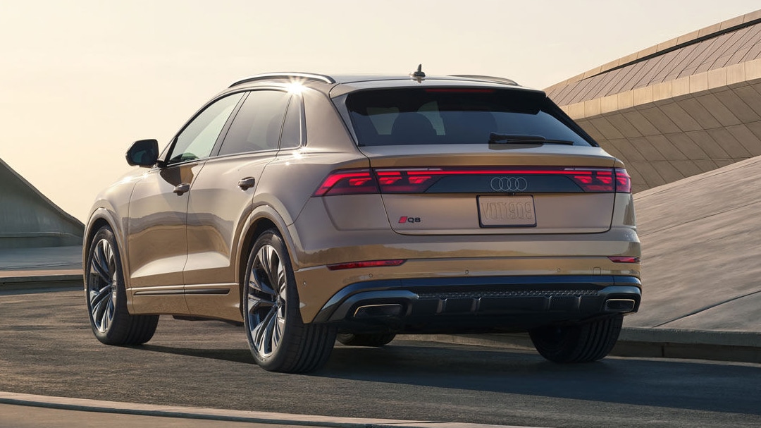 Rear view of the Audi Q8 on a sunny road
