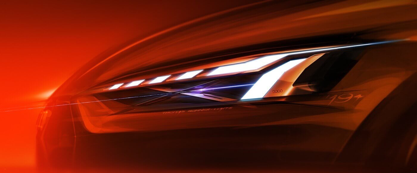 Feu avant de l'Audi A5 sur un fond rouge radiant.