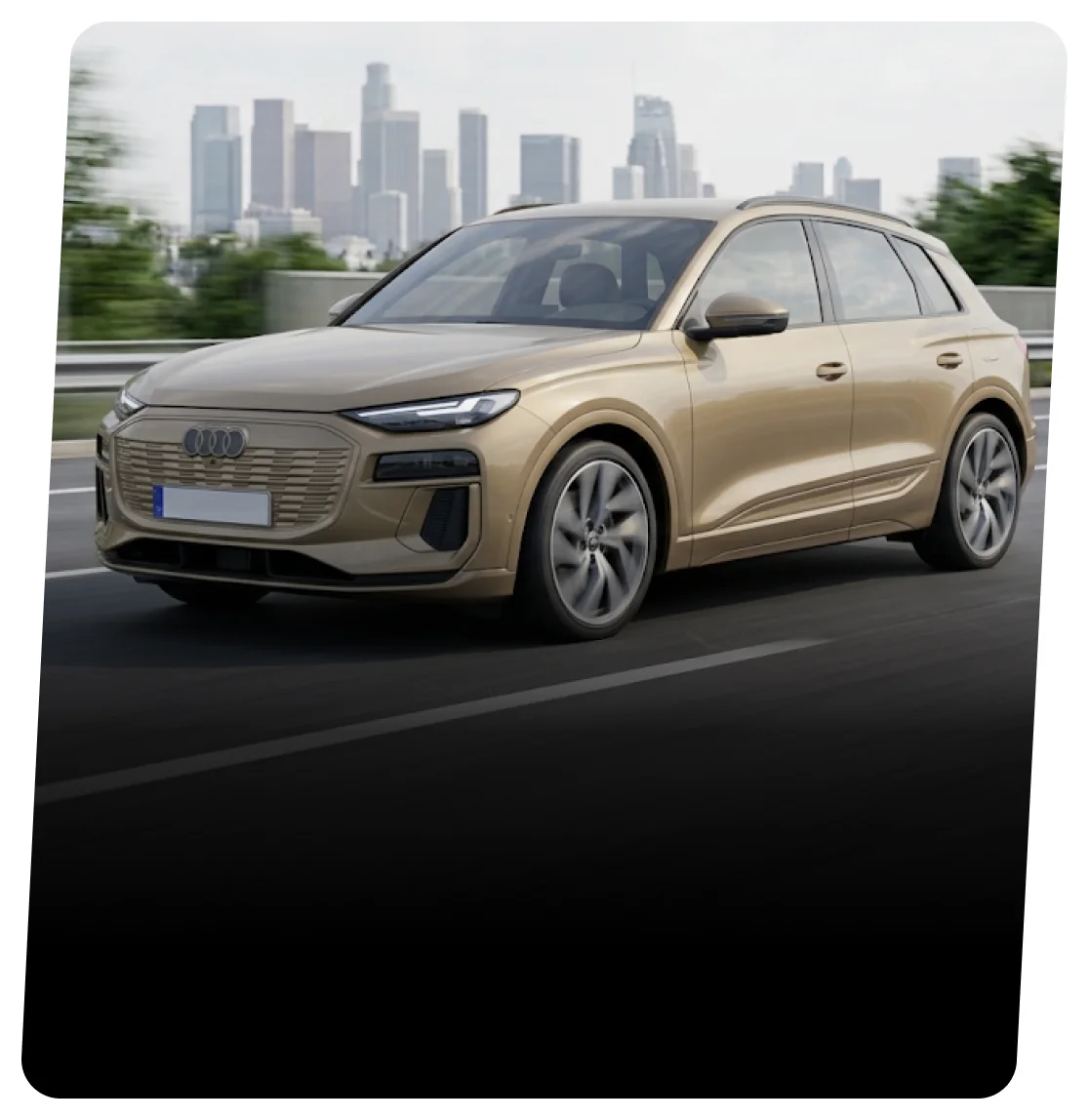 Gold Audi electric SUV driving on a highway with a city skyline behind