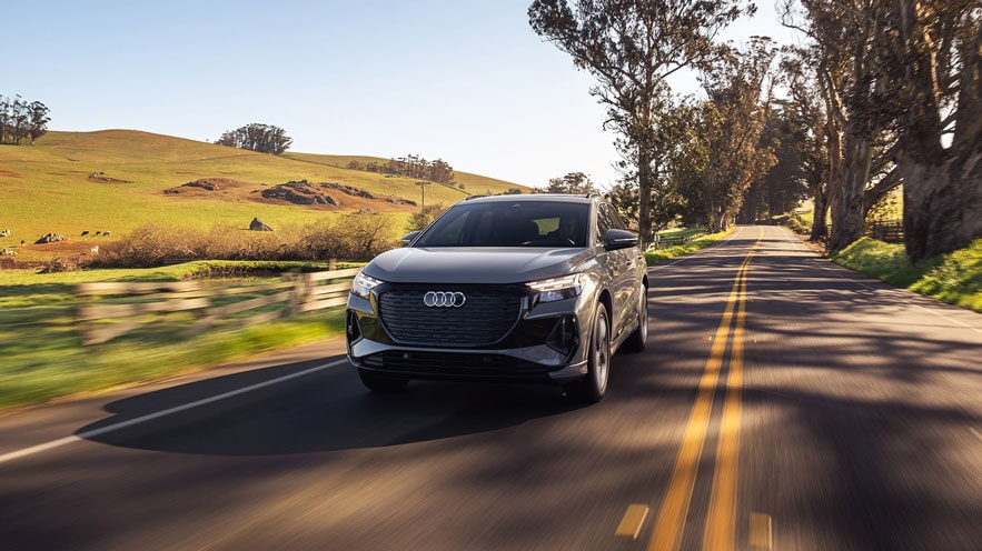 883x496_MY23---Q4-e-tron---Front---Driving-(2).jpg