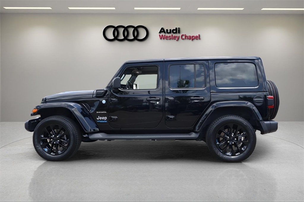 Used 2022 Jeep Wrangler Unlimited Sahara 4XE with VIN 1C4JJXP63NW264144 for sale in Wesley Chapel, FL