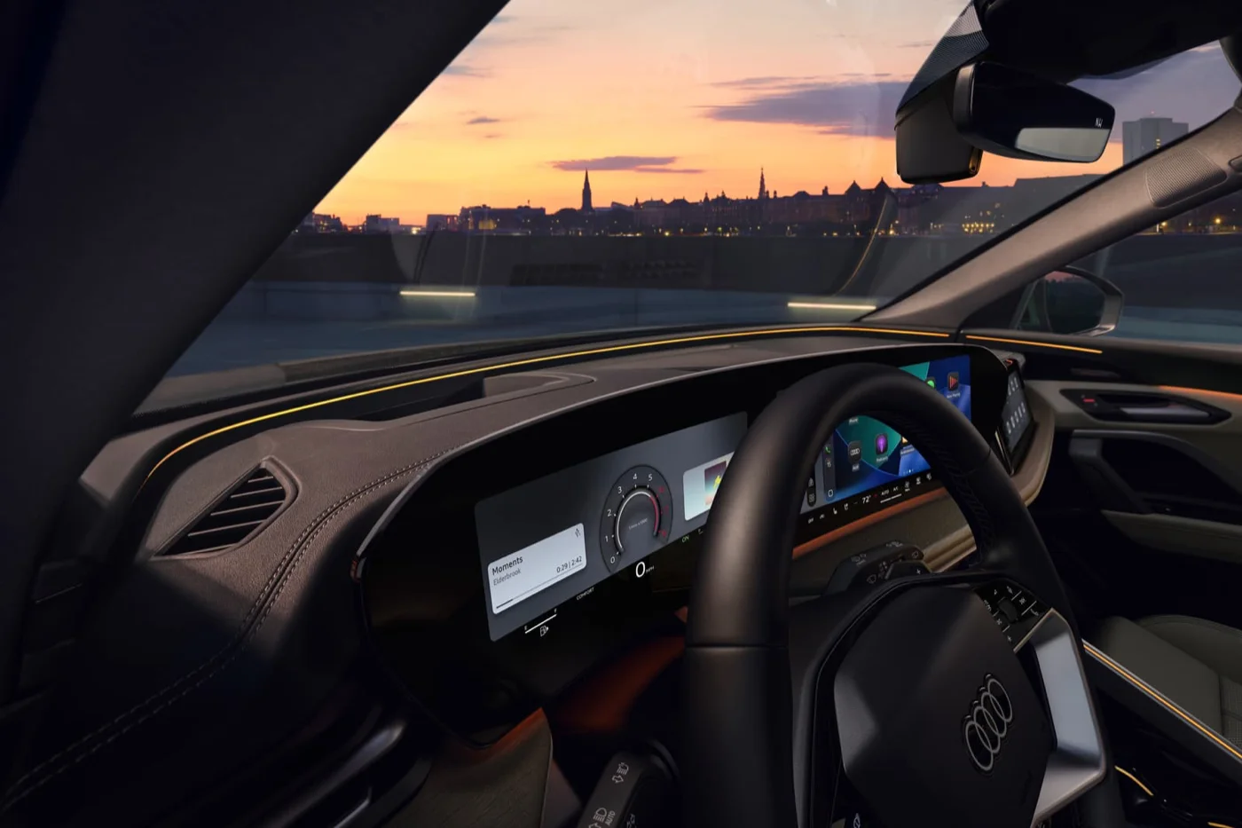 2026 Audi Q5 Audi virtual cockpit plus instrument display against a city skyline at dusk