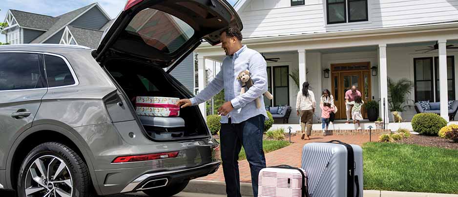 Father packing Q5 suv for college adventure