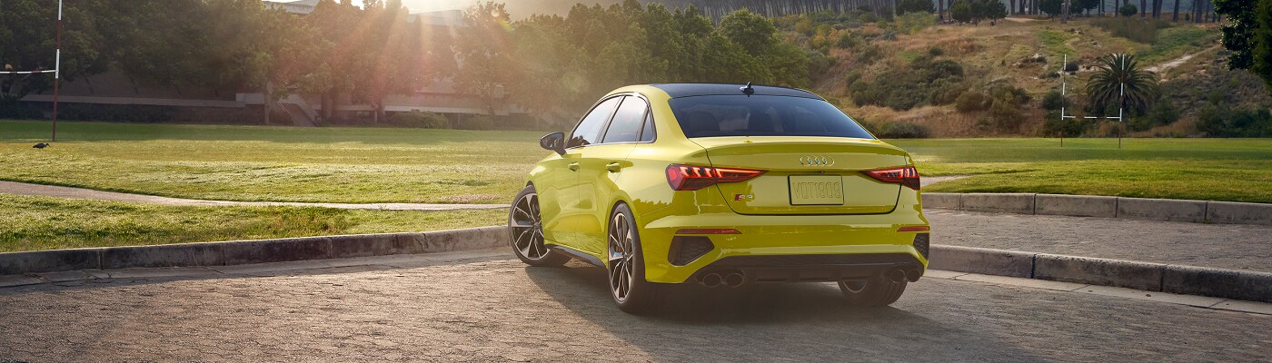 Audi S3 parked by a soccer pitch