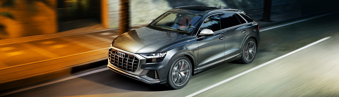 Audi SQ8 Prestige driving on a road at night