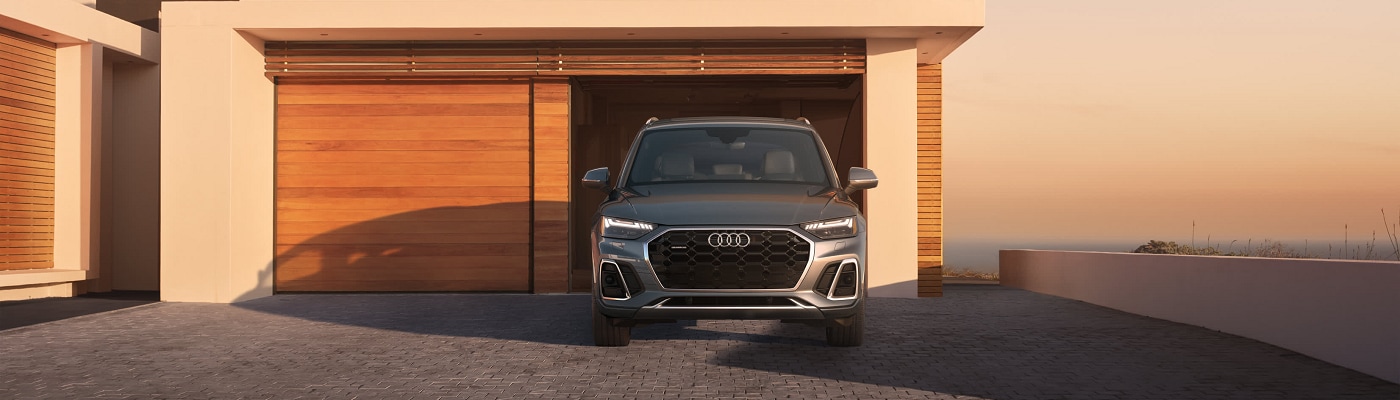 Audi Q5 e PHEV parked at a beach house