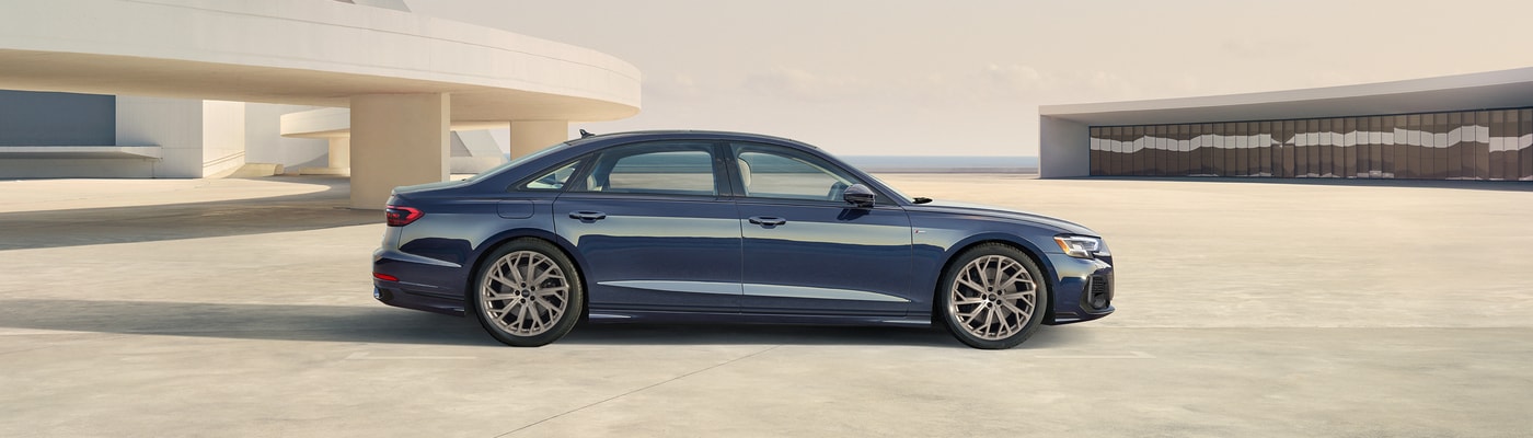 Audi A8 parked on top of an industrial building
