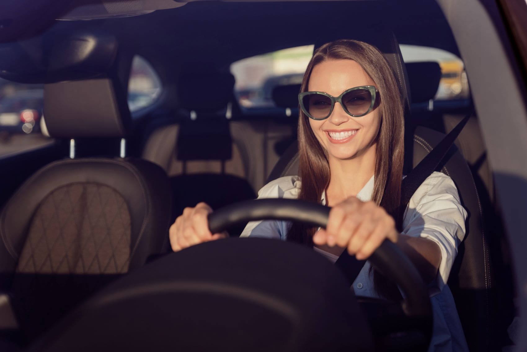 Woman Driving an Electric Audi Around Medfield MA