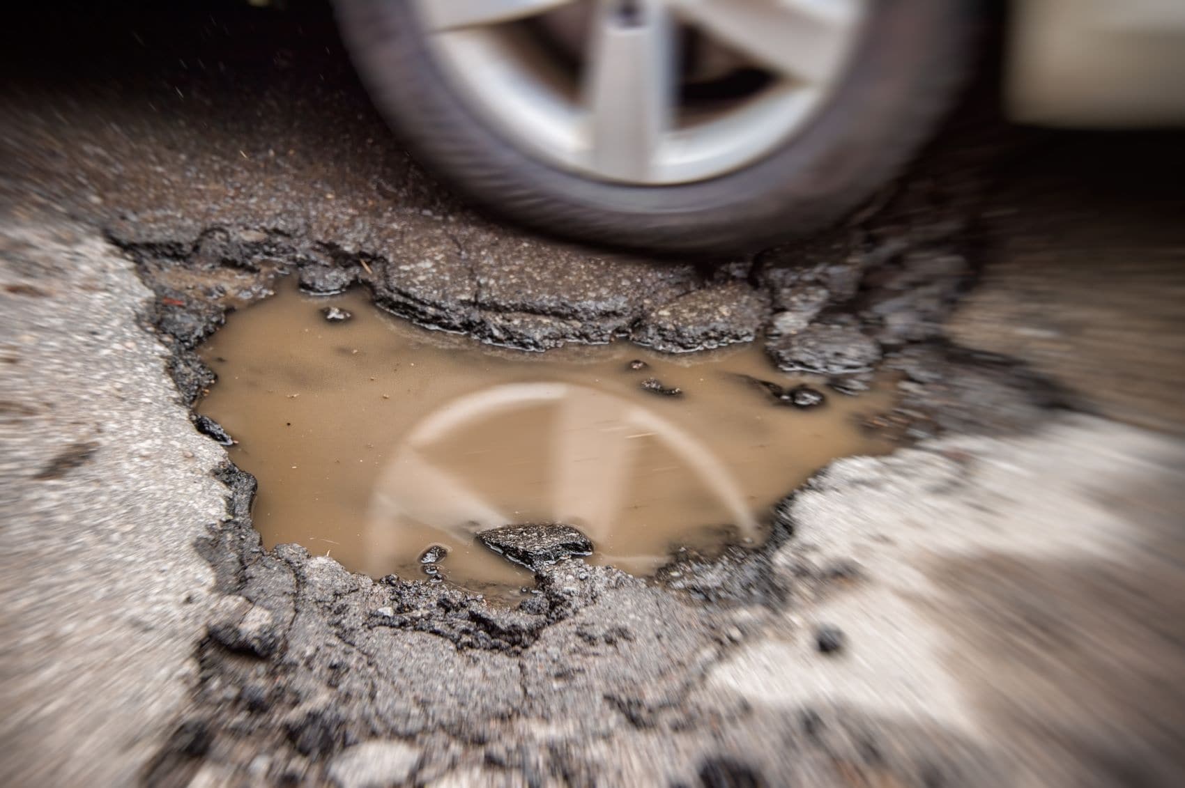 Pothole Next to Tire