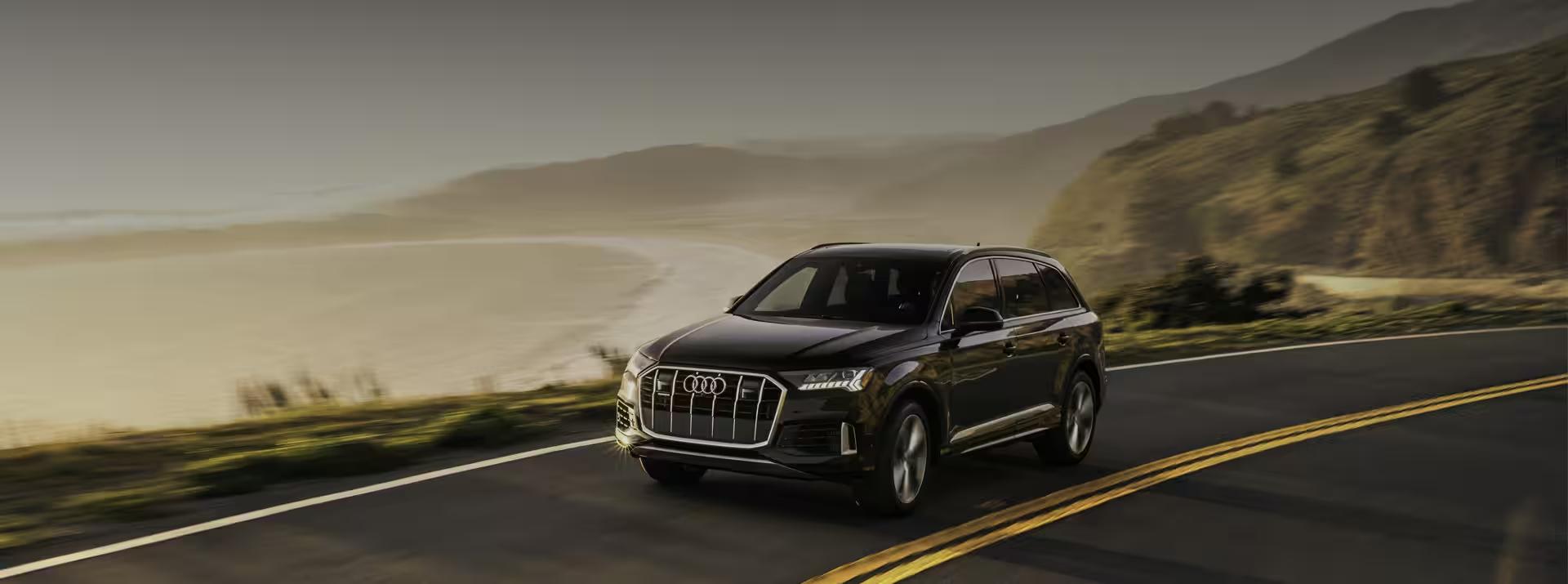An Audi driving in the country