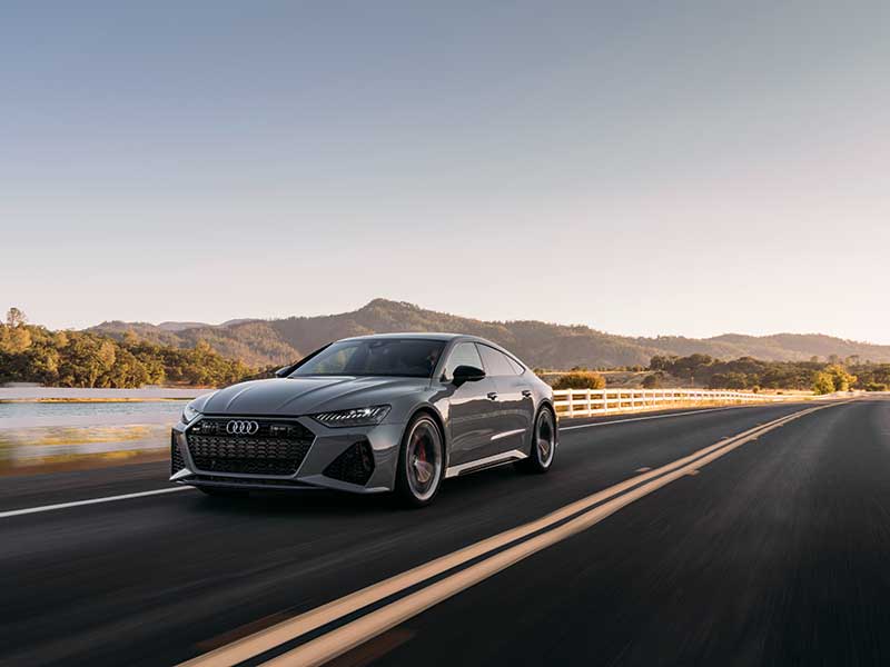2024 Audi RS 7 Sportback Performance front view driving on road by lake