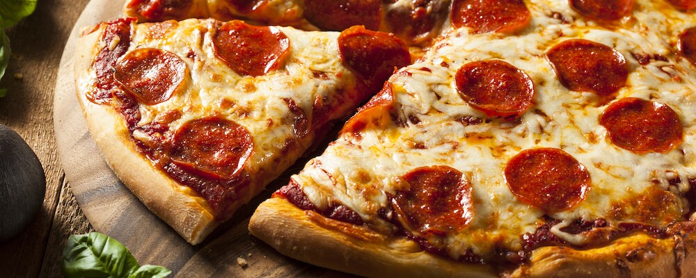 Pepperoni Pizza Slice on a Cutting Board