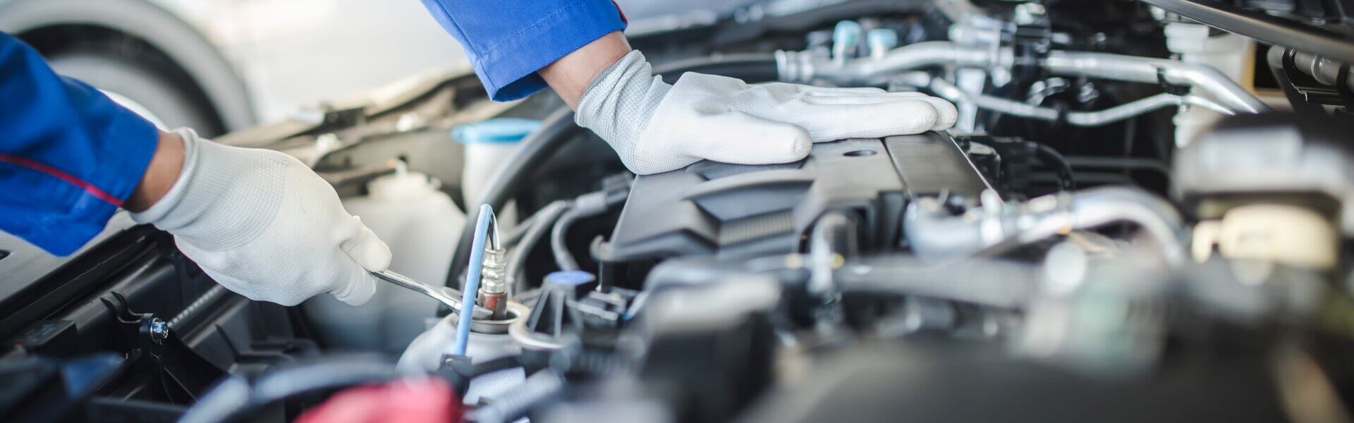 Service Technician Working on Engine