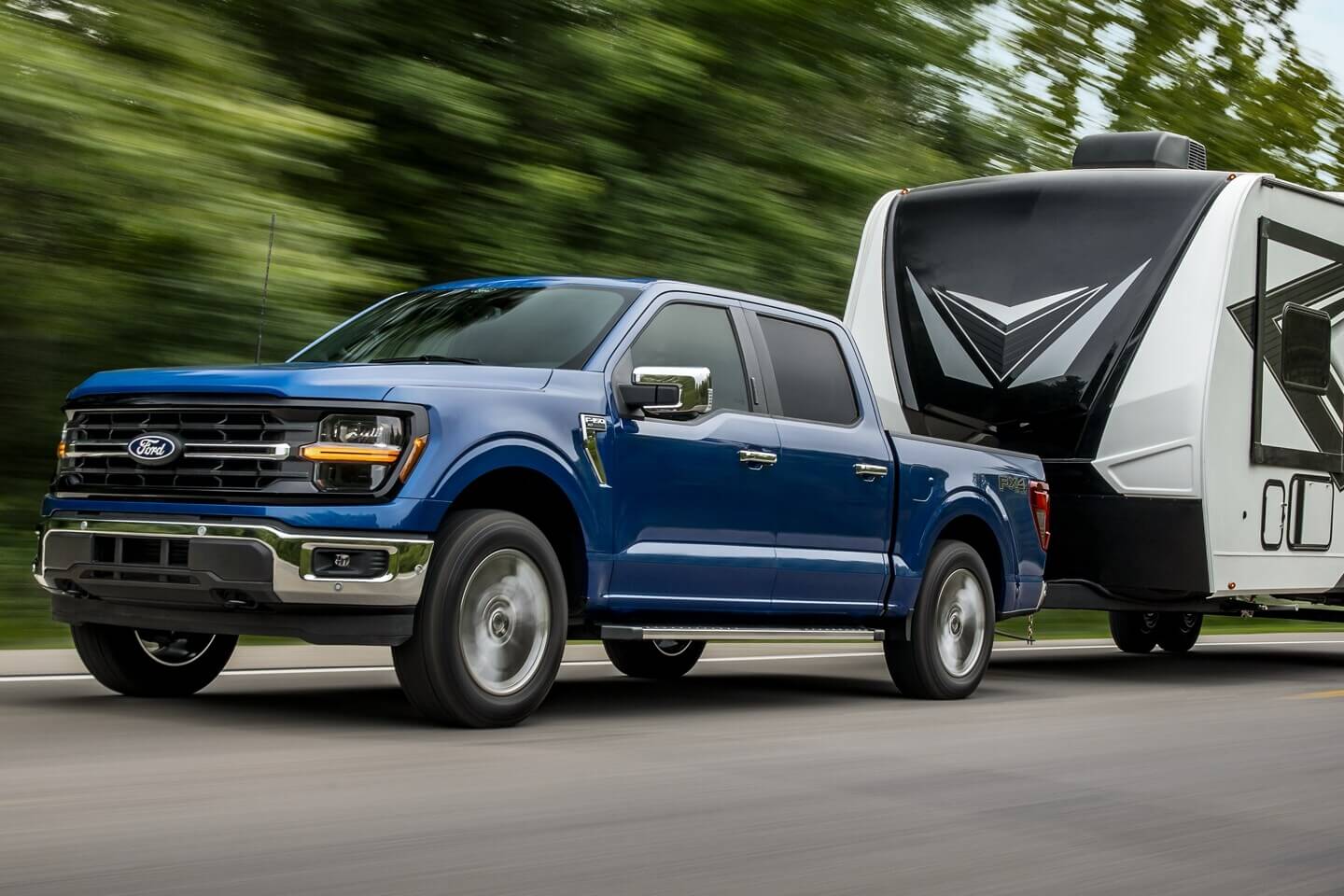 Learn about Which Ford Trucks have a Power Tailgate Exterior shot blue F-150 Ford Truck
