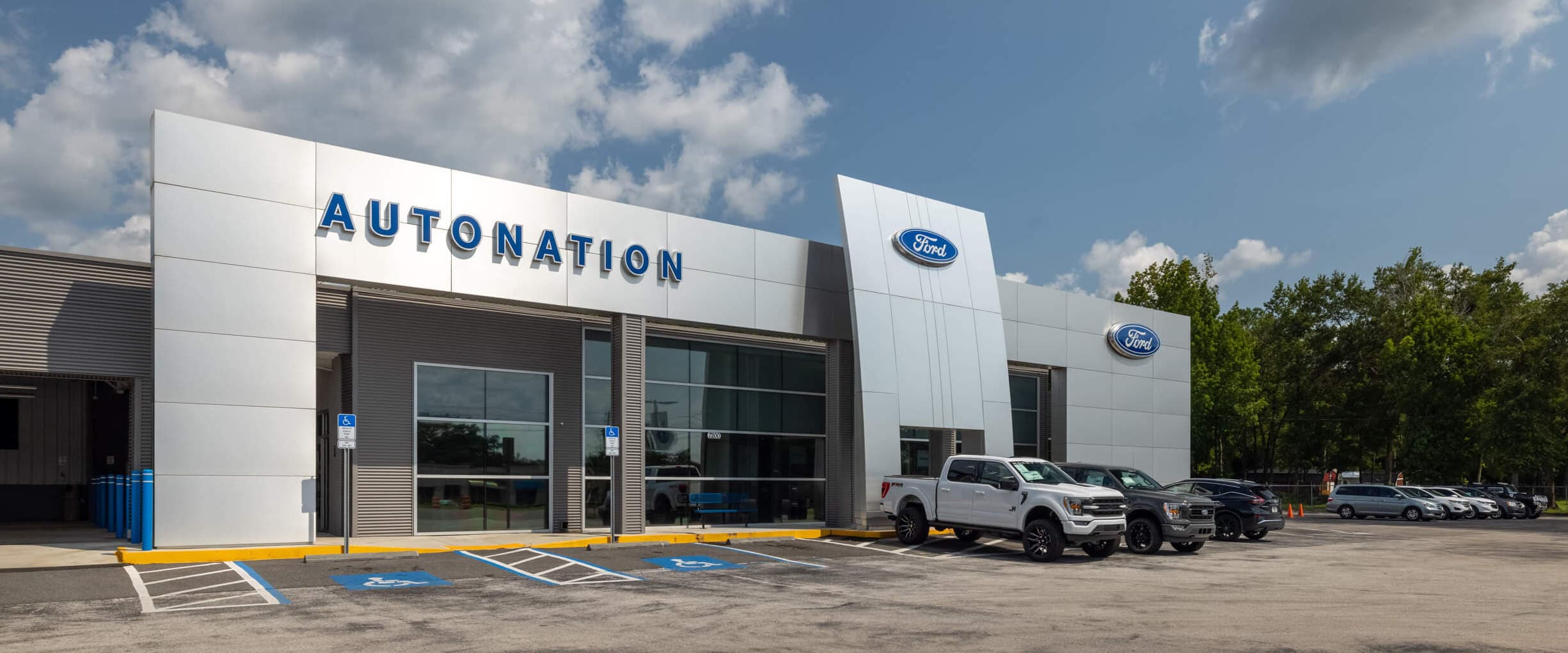 Auto Nation Ford Brooksville exterior with cars parked near the building