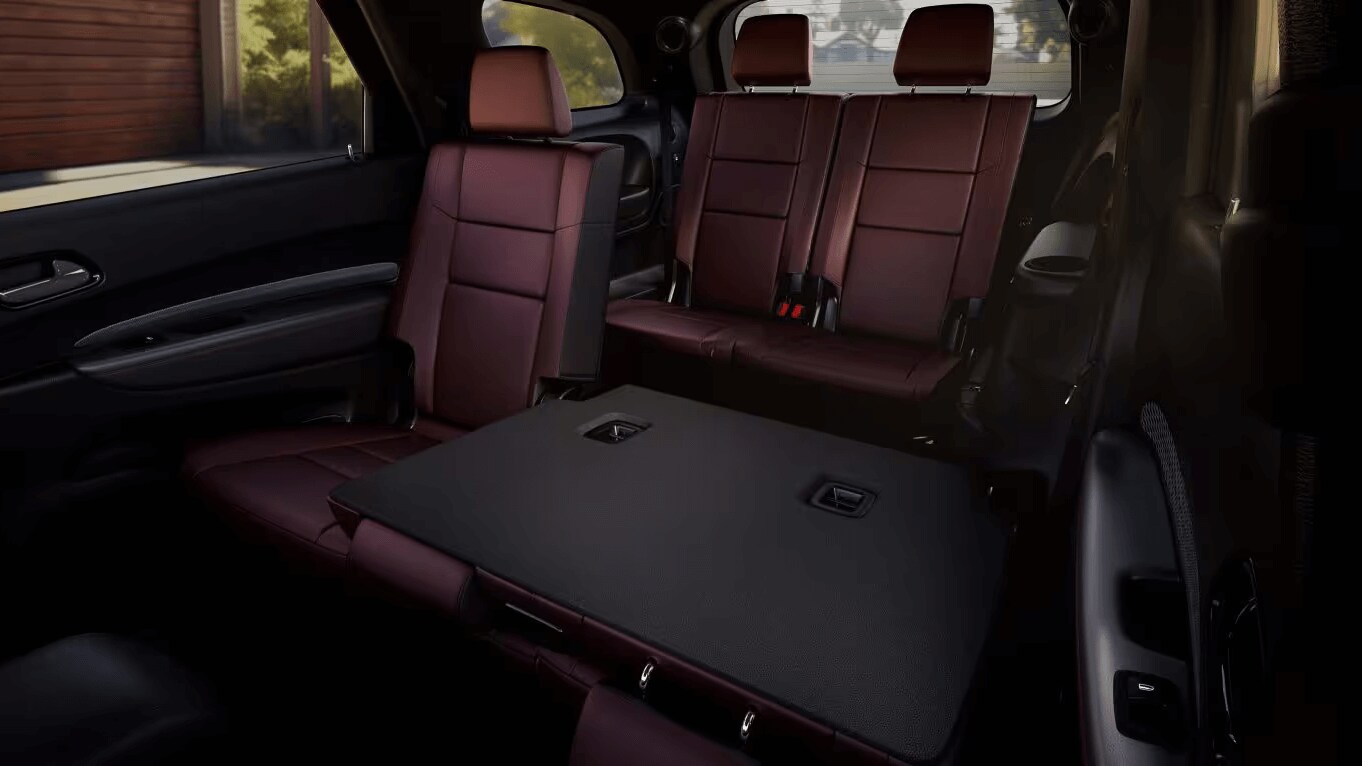 Learn about the interior design of the Dodge Durango Interior shot of the Dodge Durango showing the second and third row seats