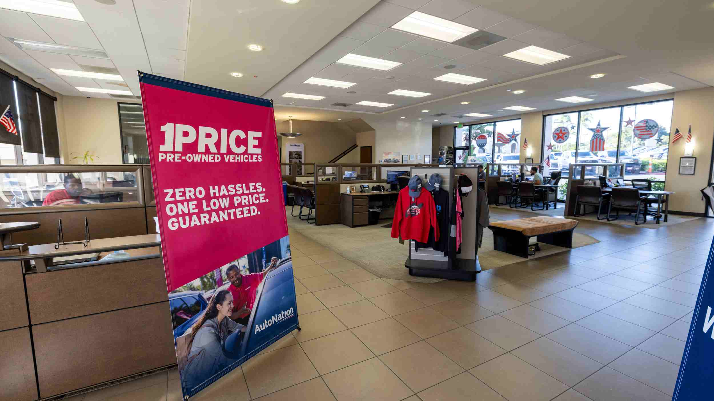 Find out about buying, servicing, and financing Dodge, Jeep, Chrysler, Ram vehicles at AutoNation Chrysler Dodge Jeep Ram Carlsbad Interior view of AutoNation Chrysler Dodge Jeep Ram Carlsbad customer lounge, showing chairs, tables, and 1Price sign