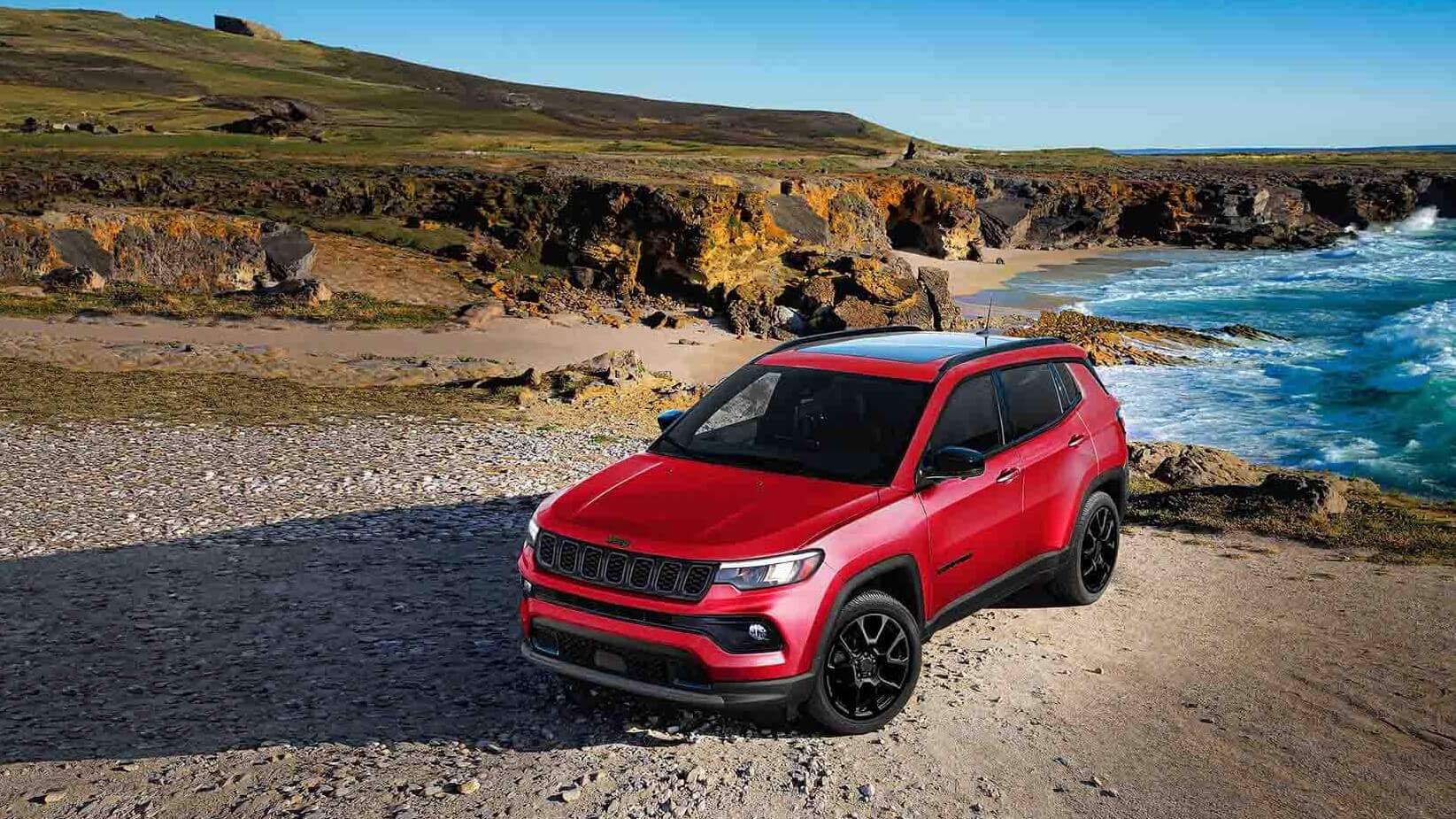 A Jeep Compass parked on a seaside cliff