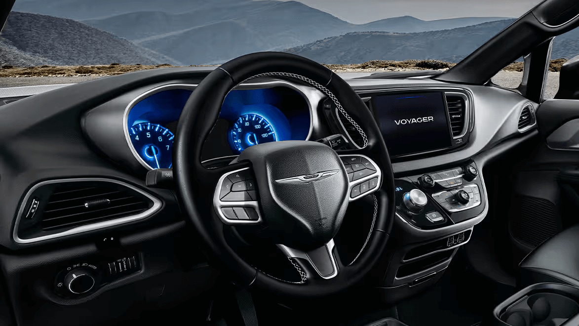 Learn about the performance features of the Chrysler Voyager Interior shot of the Chrysler Voyager, showing the steering wheel and the illuminated digital gauge cluster