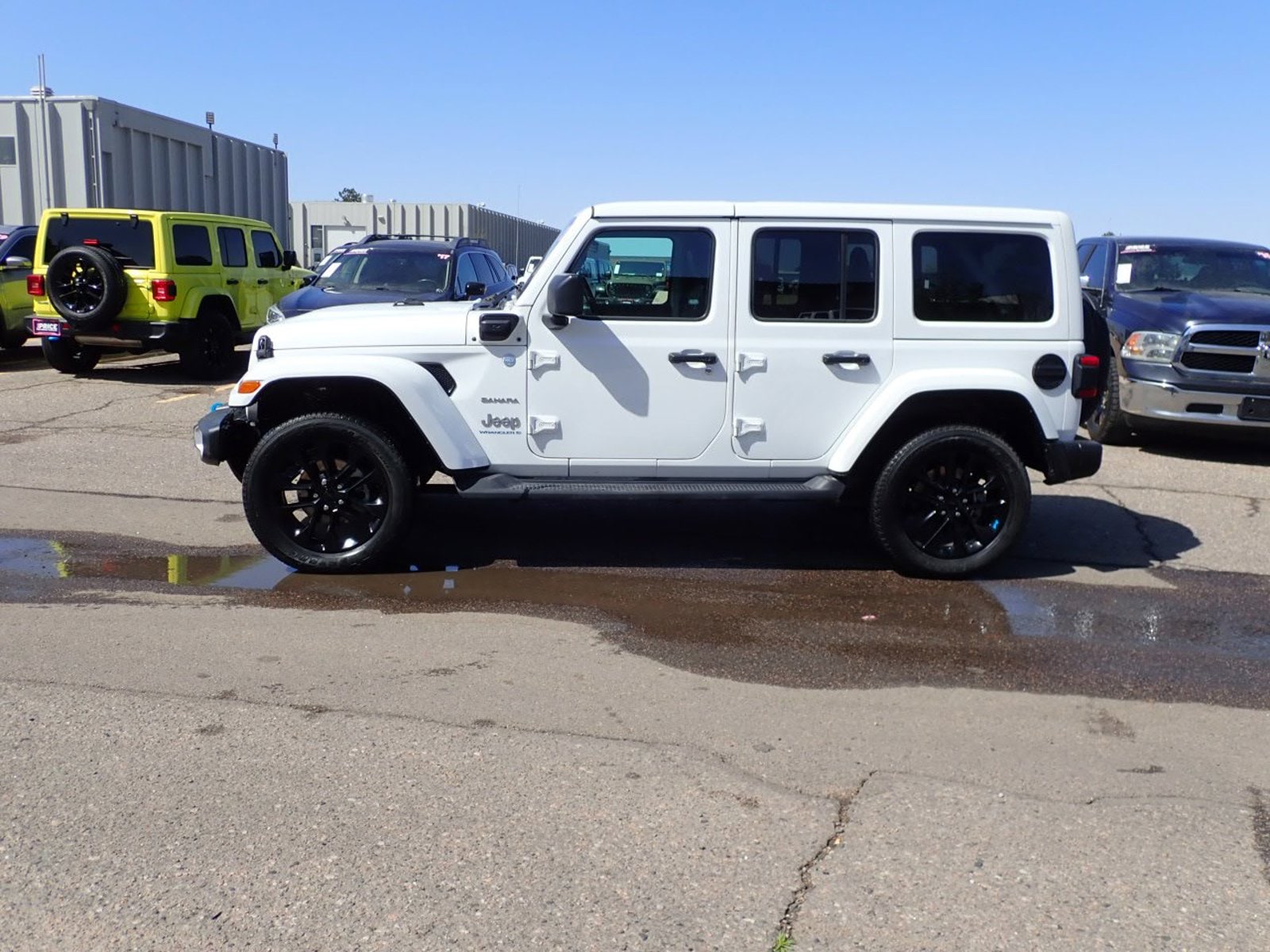 Used 2023 Jeep Wrangler 4xe Sahara 4XE with VIN 1C4JJXP68PW516375 for sale in Englewood, CO