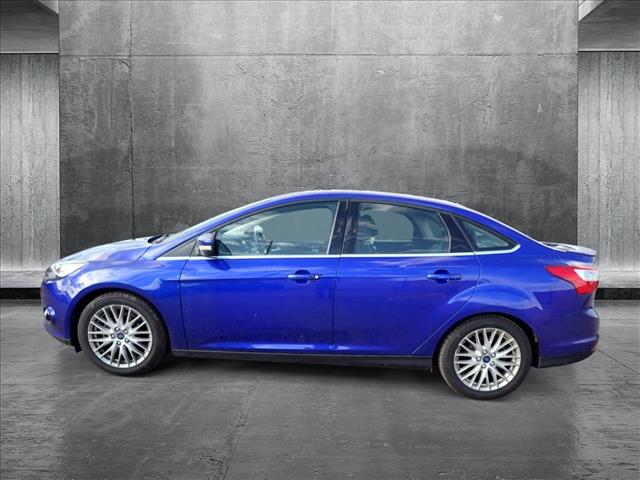 Used 2014 Ford Focus Titanium with VIN 1FADP3J25EL236878 for sale in Englewood, CO