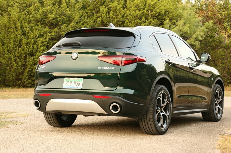The sloped roofline and flared hips give the Stelvio’s rear a muscular feel.