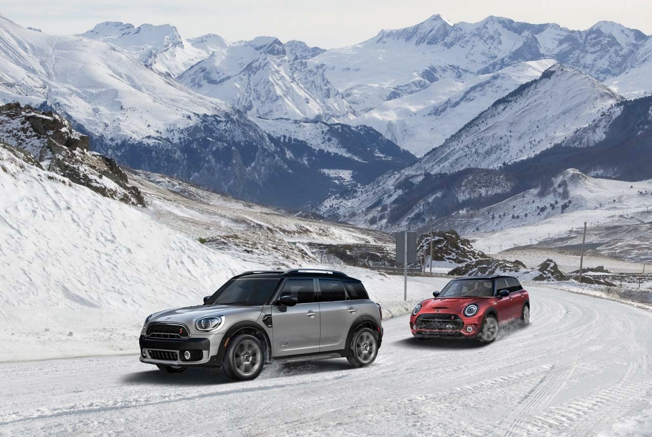 Image of MINI Clubman vehicles driving through a wintry mountain pass