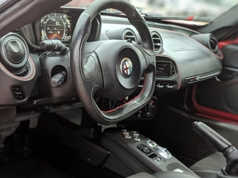 The Alfa Romeo 4C doesn’t feature a lot of creature comforts — but there is a cup holder.