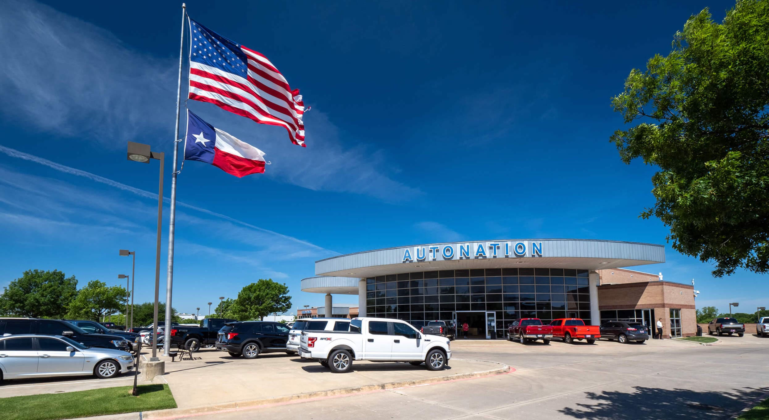 AutoNation Ford Frisco Exterior with American flag flying