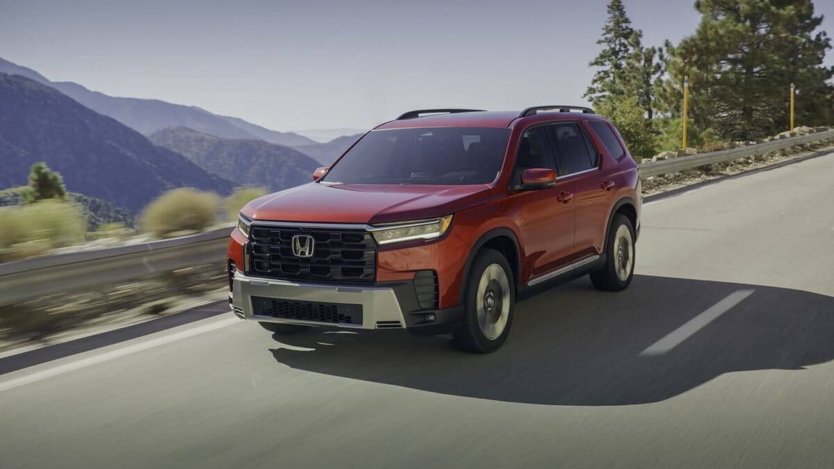 Honda Pilot driving down a mountainside road