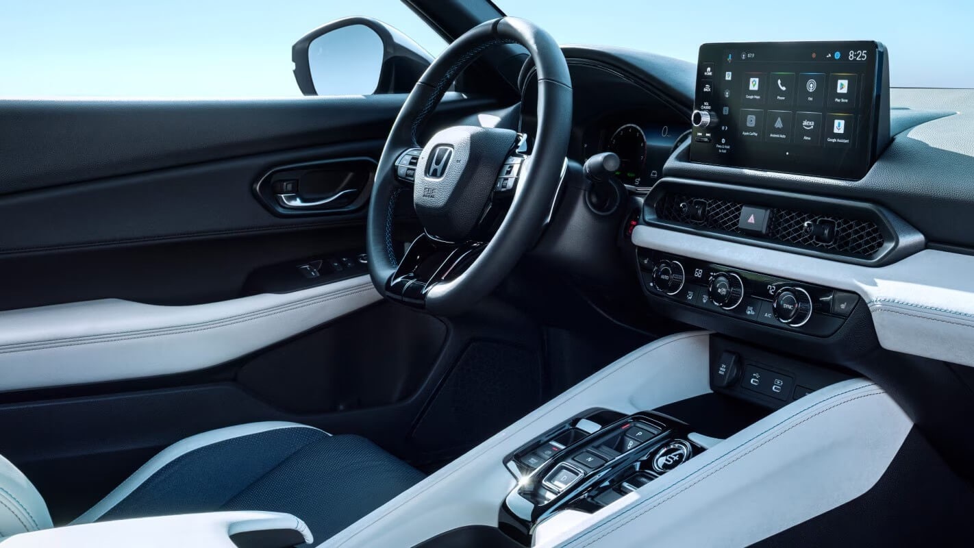 Internal shot of Honda Prelude showing the steeering wheel and ceneter console