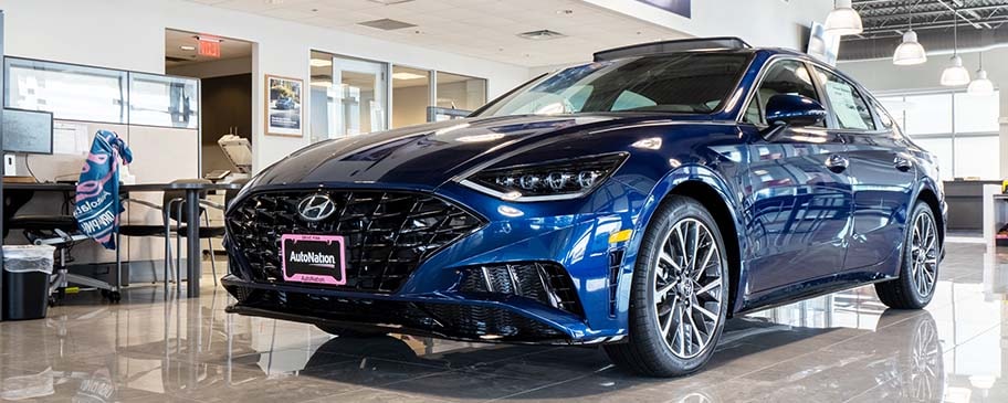 Find out about financing at AutoNation Hyundai Corpus Christi Blue Hyundai parked inside AutoNation Hyundai Corpus Christi.