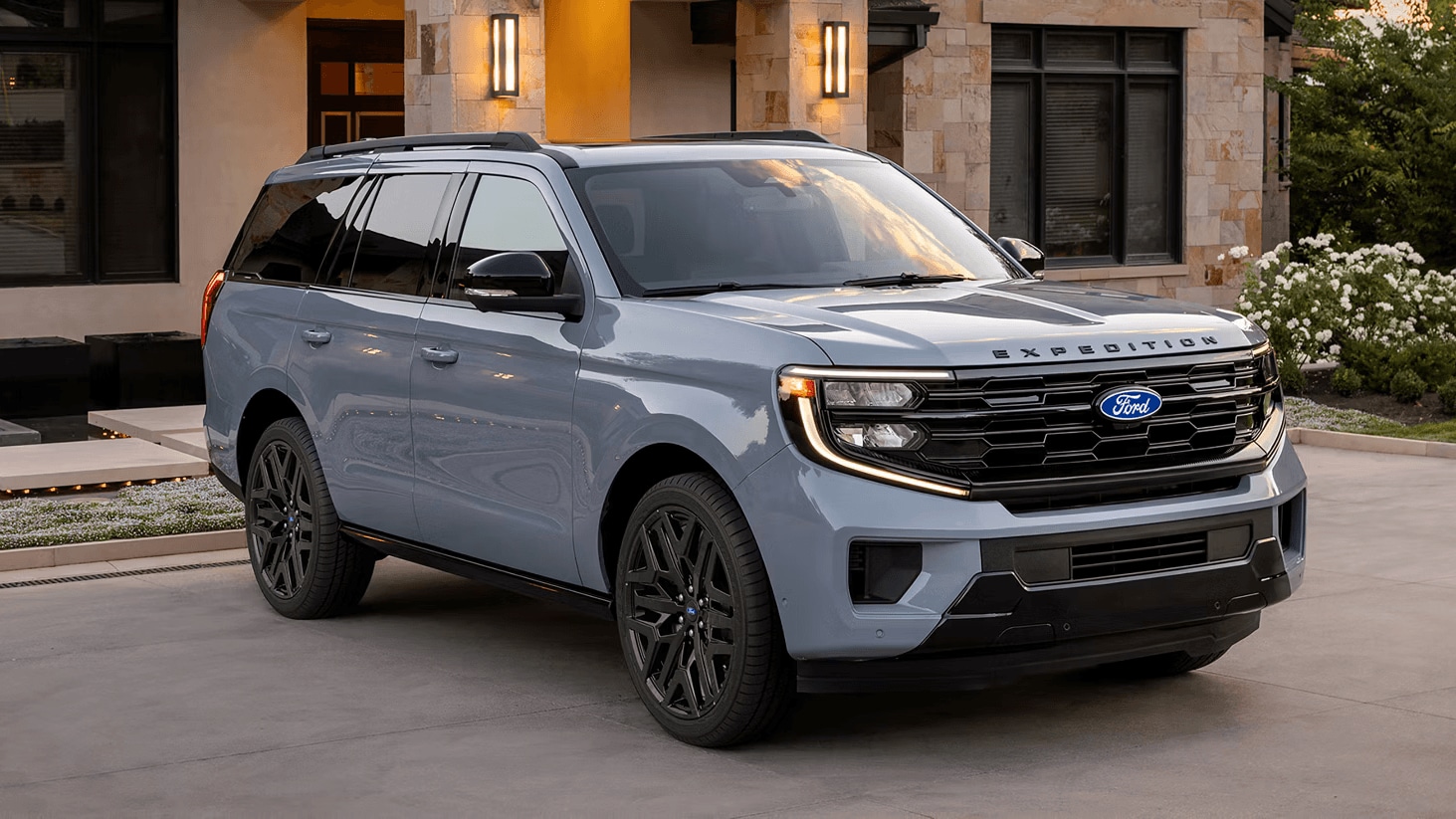 Ford Expedition parked in front of a residence