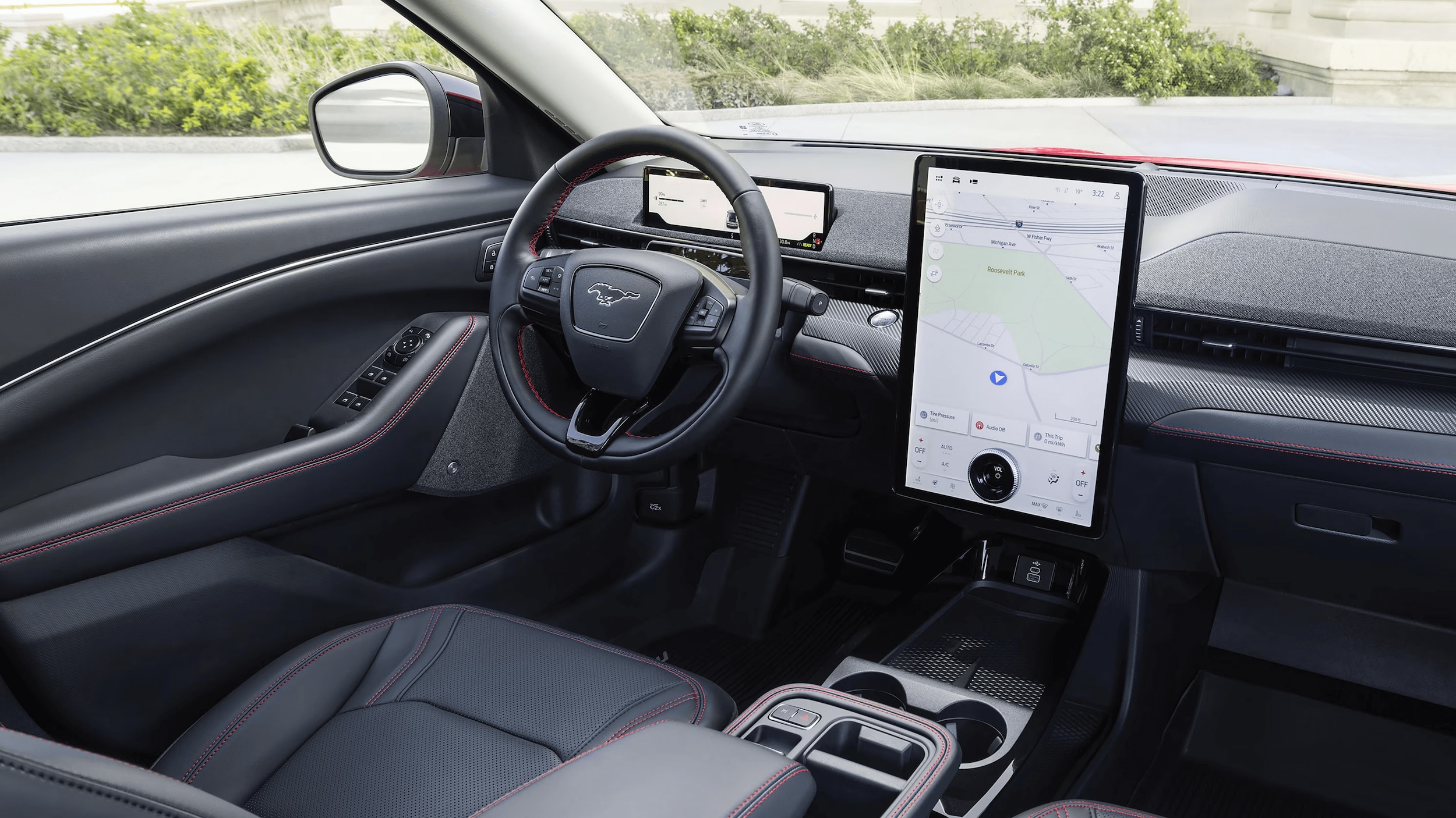 Learn about the technology features of the Ford Mustang Mach-E Internal shot of the steering wheel and console of the Ford Mustang Mach-E