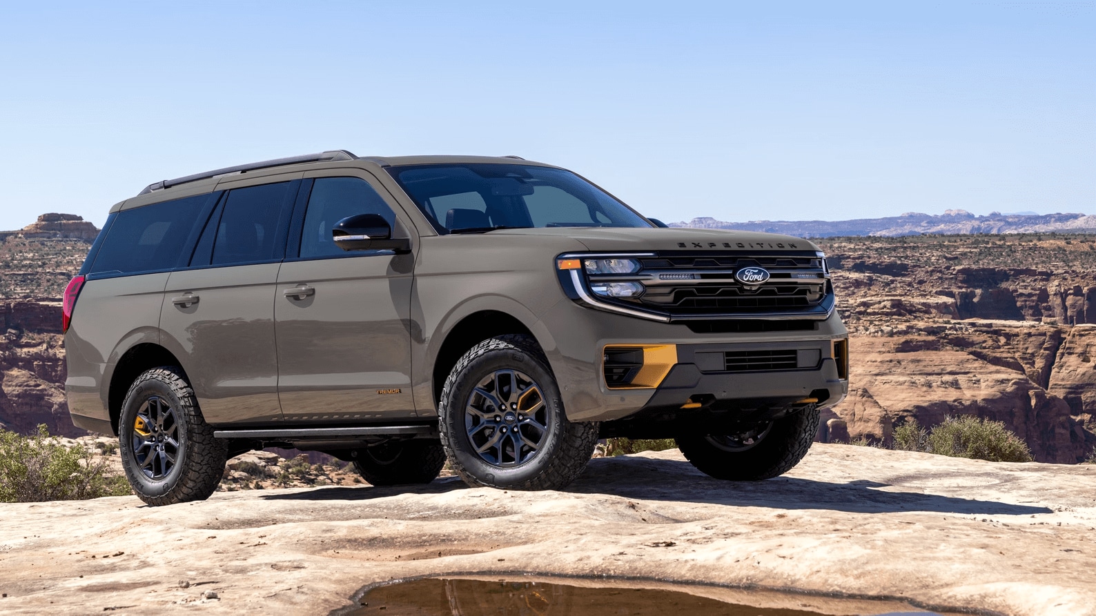 Ford Expedition parked atop a rock formation