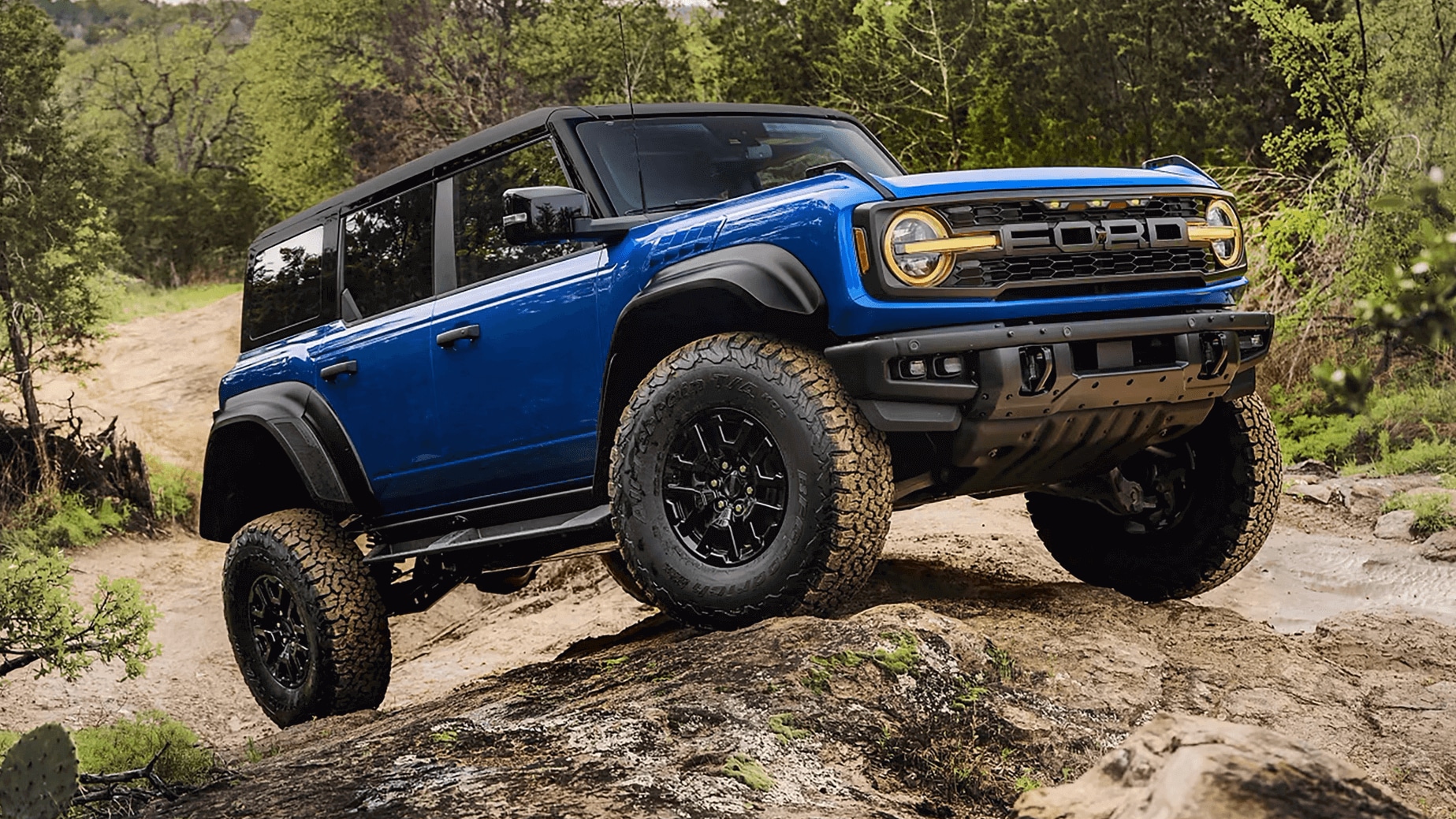 Ford Bronco ascending a rock formation