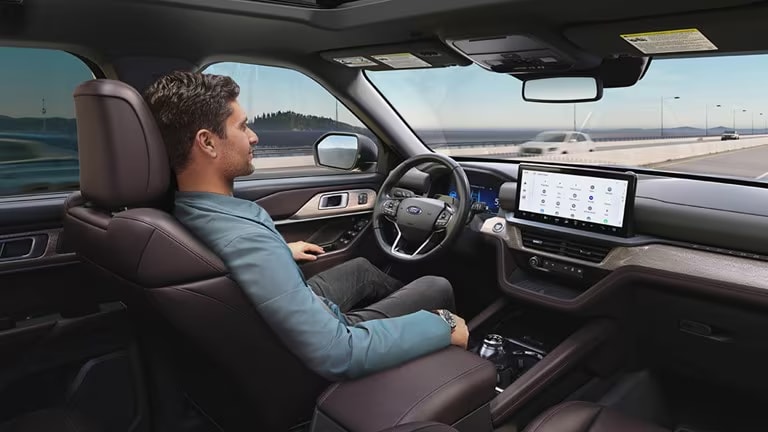 An image of a man using BlueCruise hands-free driving.
