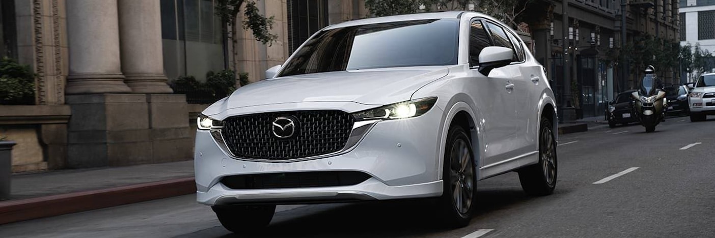 New Mazda CX-5 driving down a road