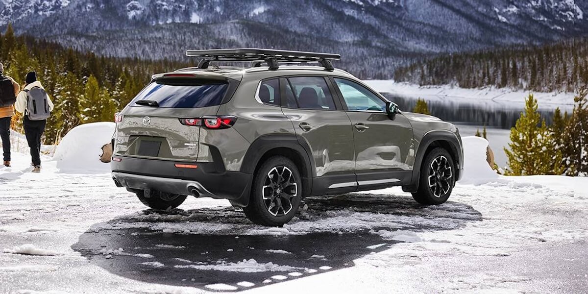 Rear view of a 2024 Mazda CX-50 in the snow