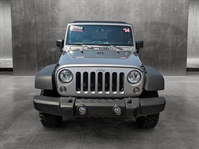 Used 2014 Jeep Wrangler Unlimited Rubicon with VIN 1C4HJWFG1EL166590 for sale in Mobile, AL