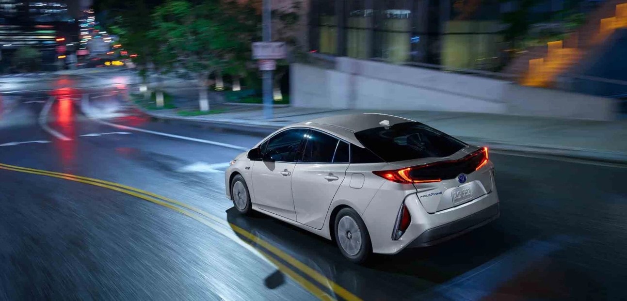 Toyota Prius driving in city at night