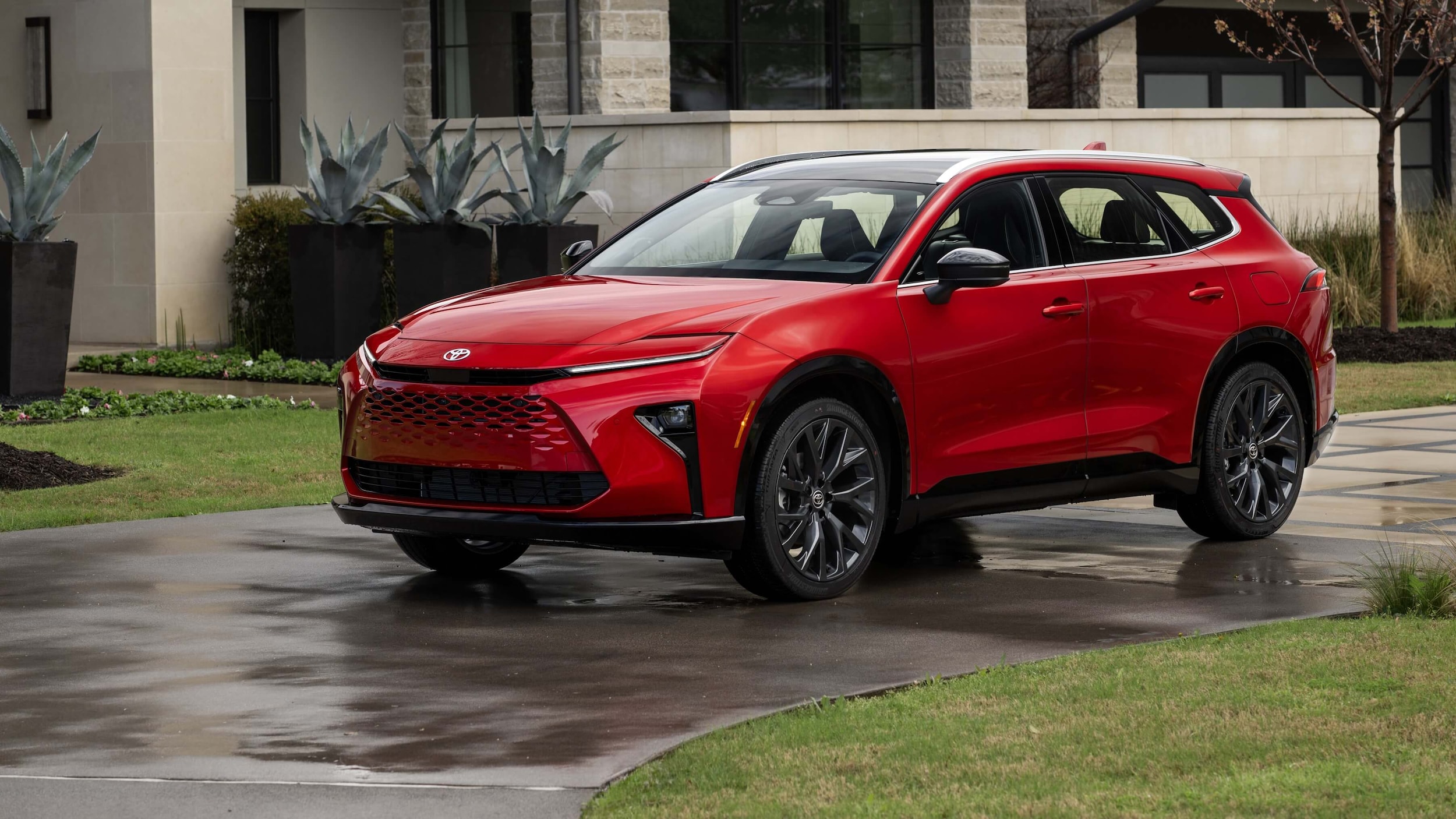 Toyota Crown Signia parked outside of a house